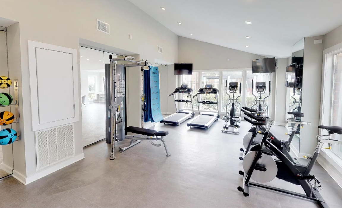 Fitness center with cardio equipment Chateau Carmel apartments amenities